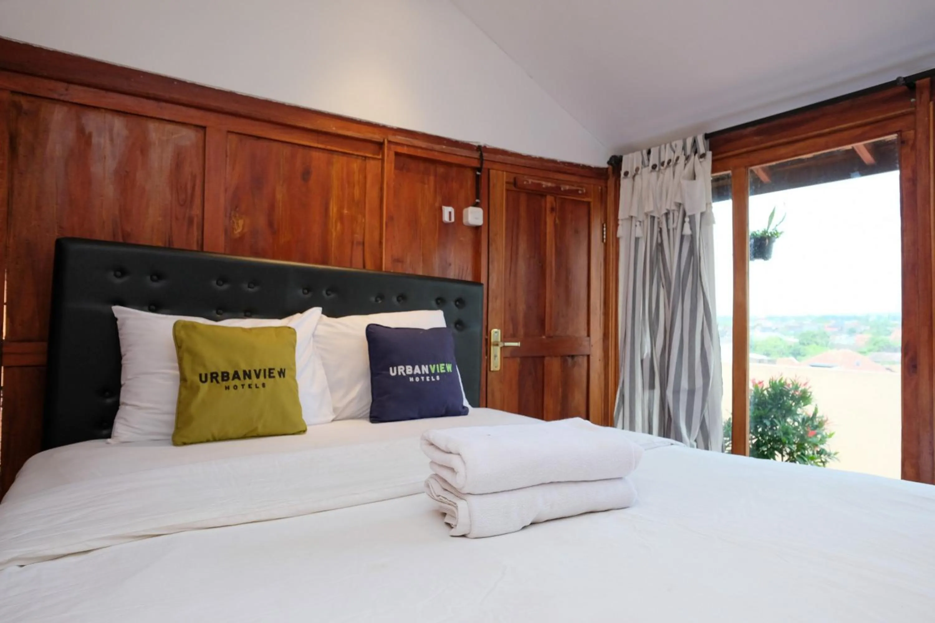 Bedroom, Bed in Urbanview Hotel Dommy Yogyakarta by RedDoorz