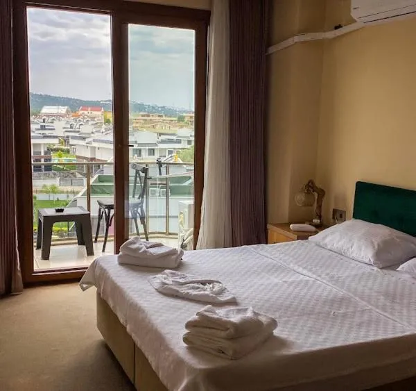 Bed in Aliento Hotel