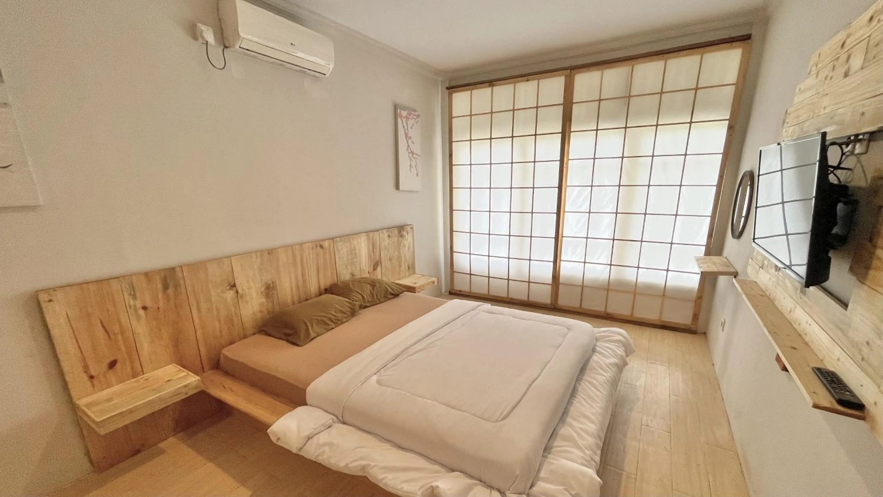 Bed in The Kanzi Hotel & Village