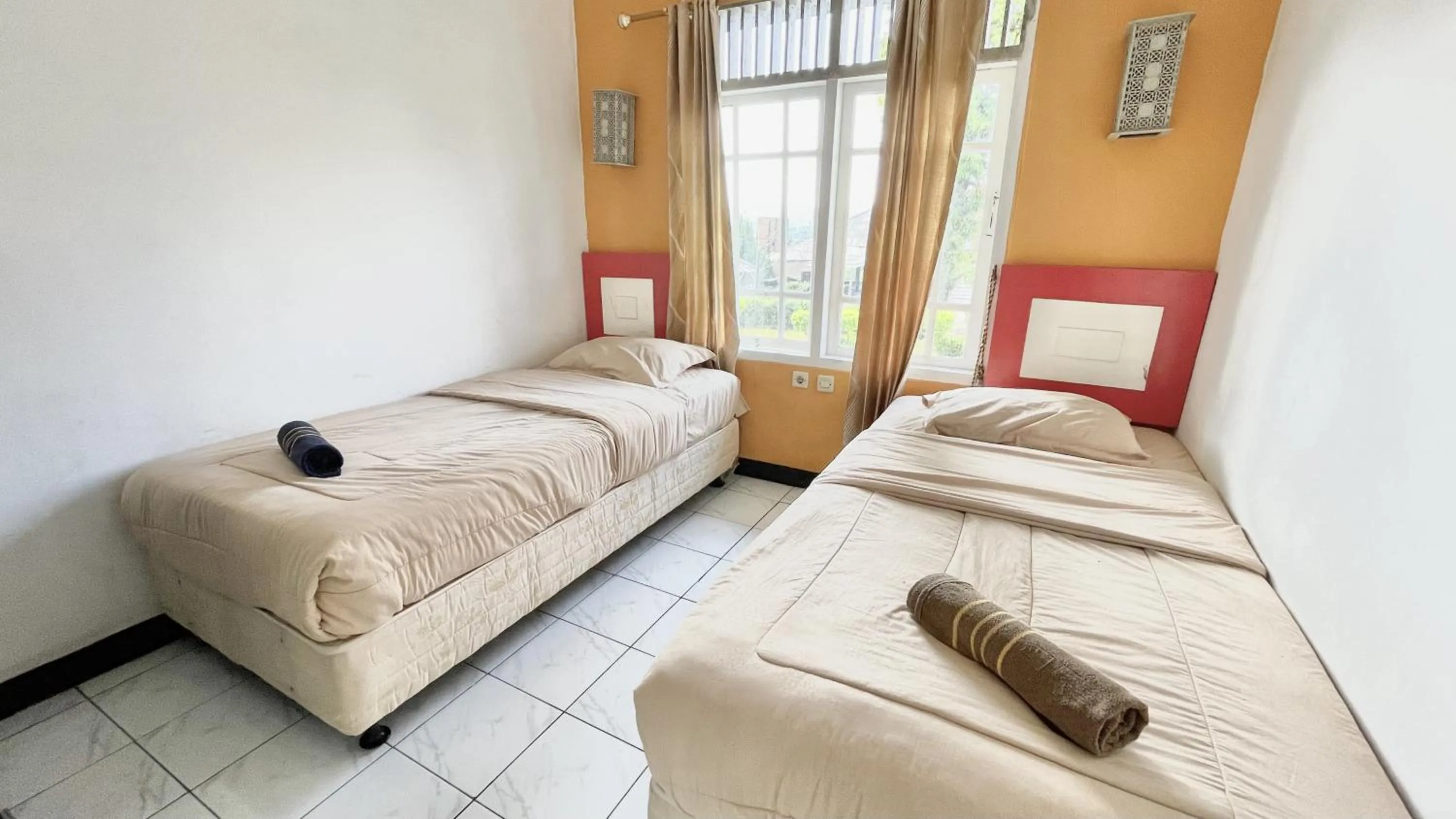 Bed in The Kanzi Hotel & Village