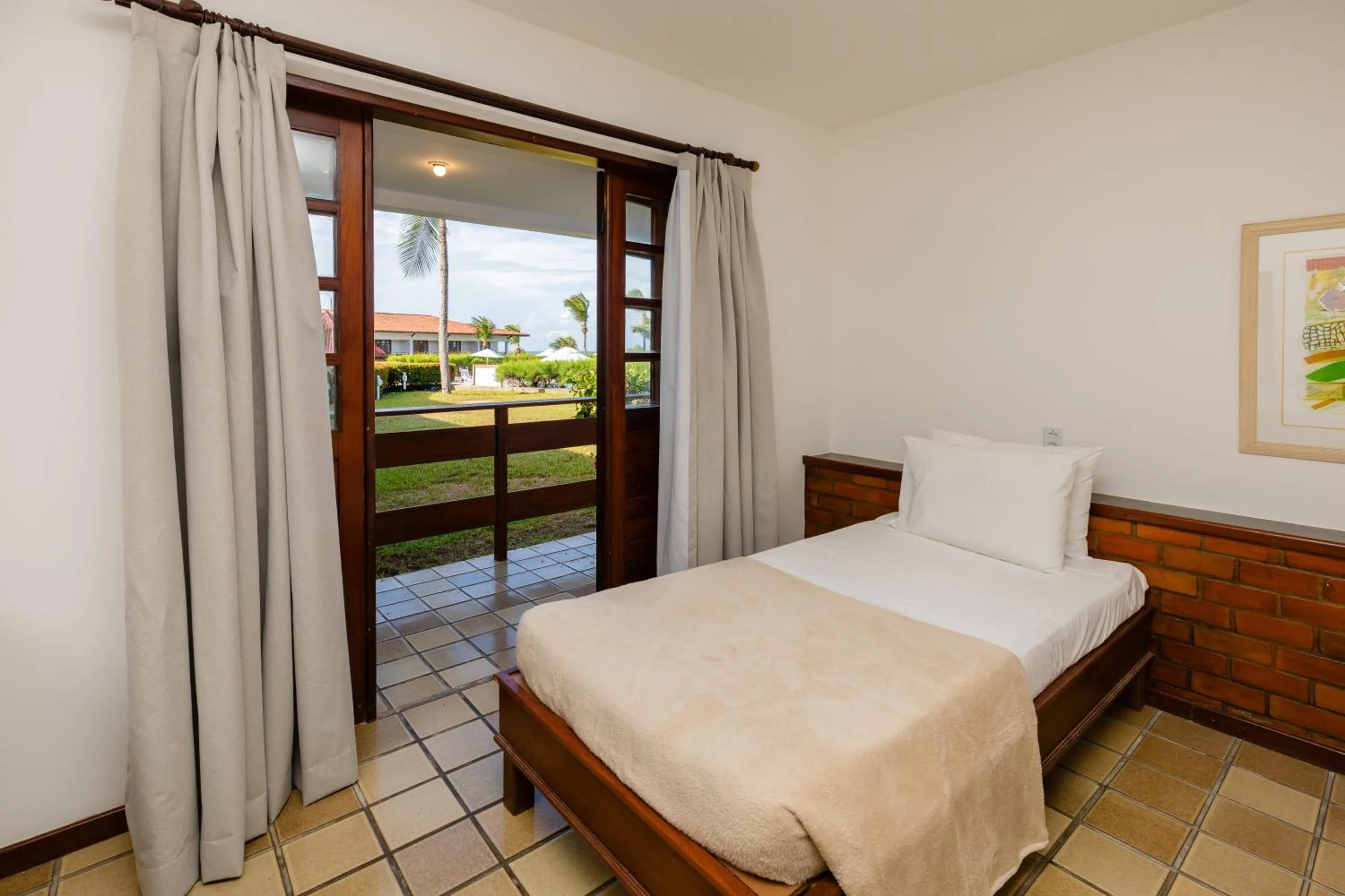 Bed in Mirai Beach Hotel