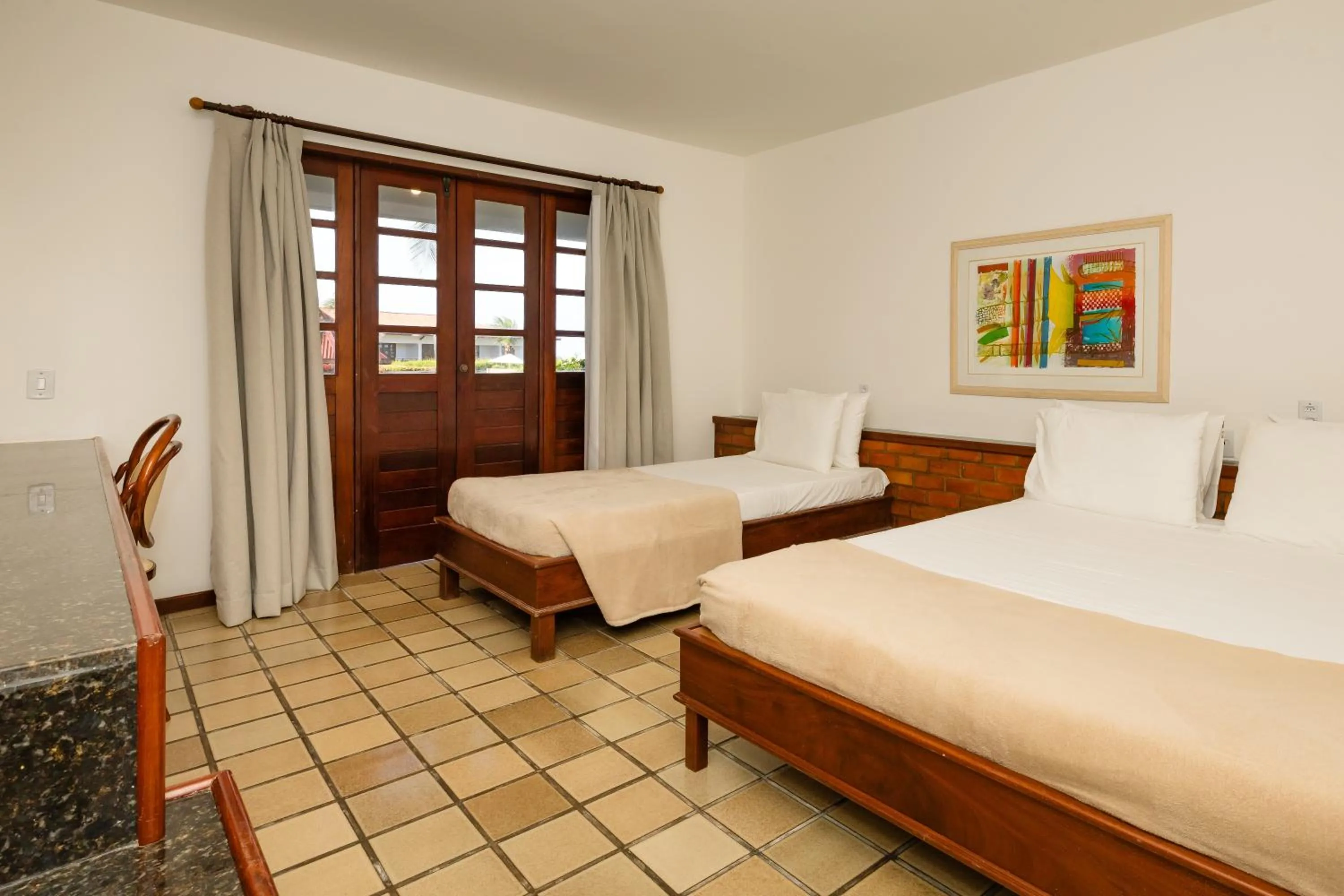 Bed in Mirai Beach Hotel