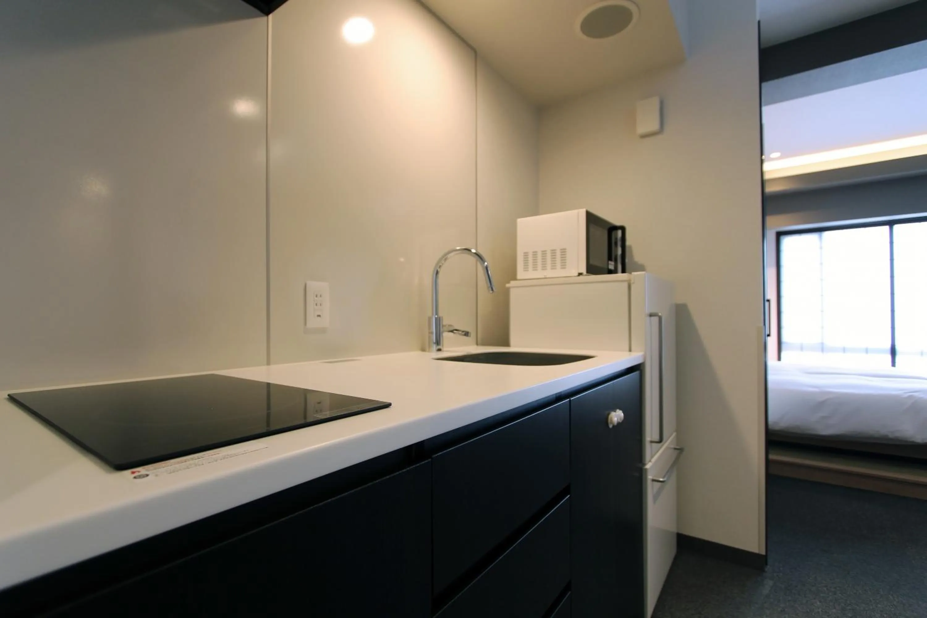 Kitchen or kitchenette in KOKO HOTEL Residence Kyoto Nijo Castle