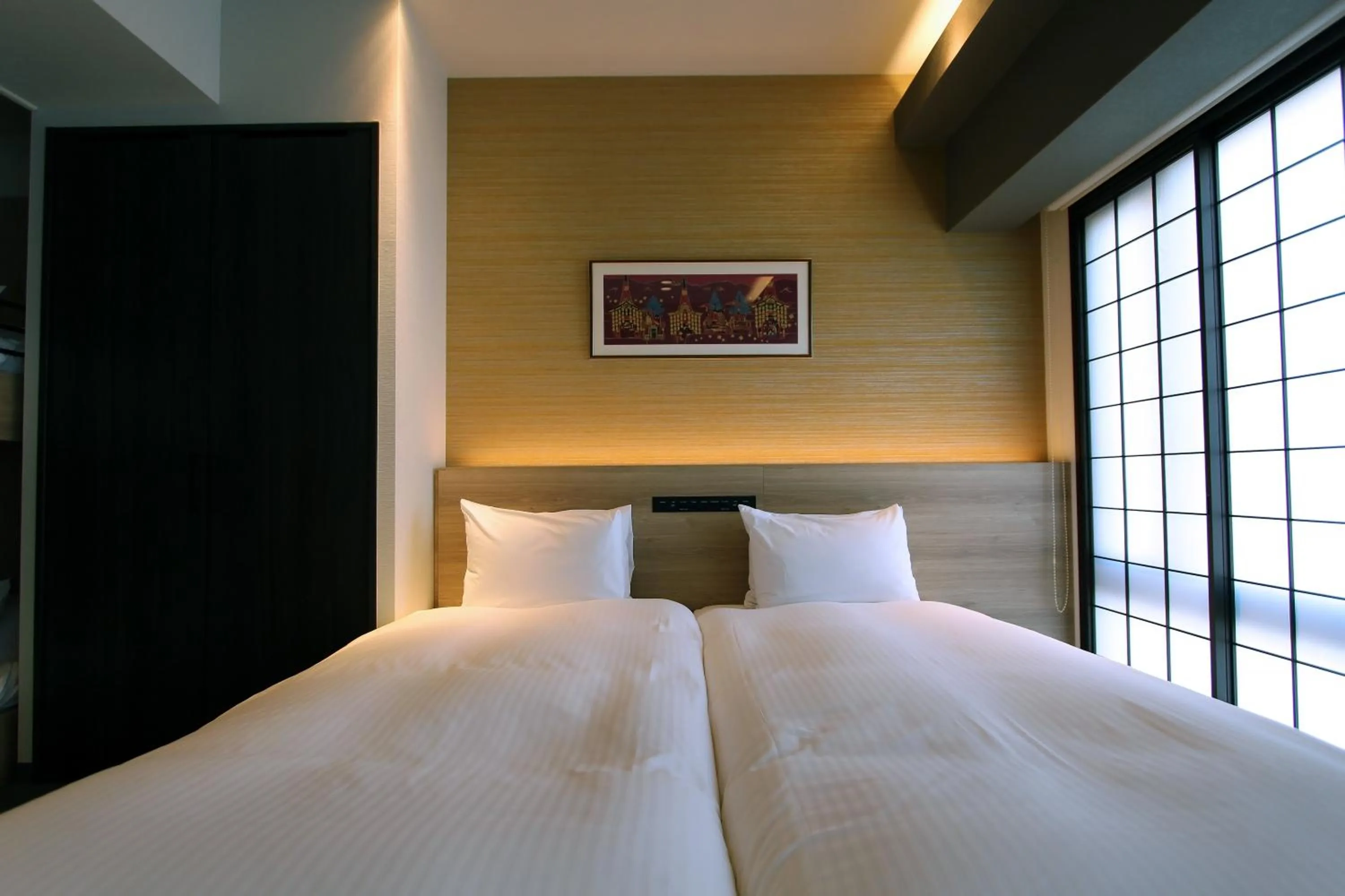 Bed in KOKO HOTEL Residence Kyoto Nijo Castle