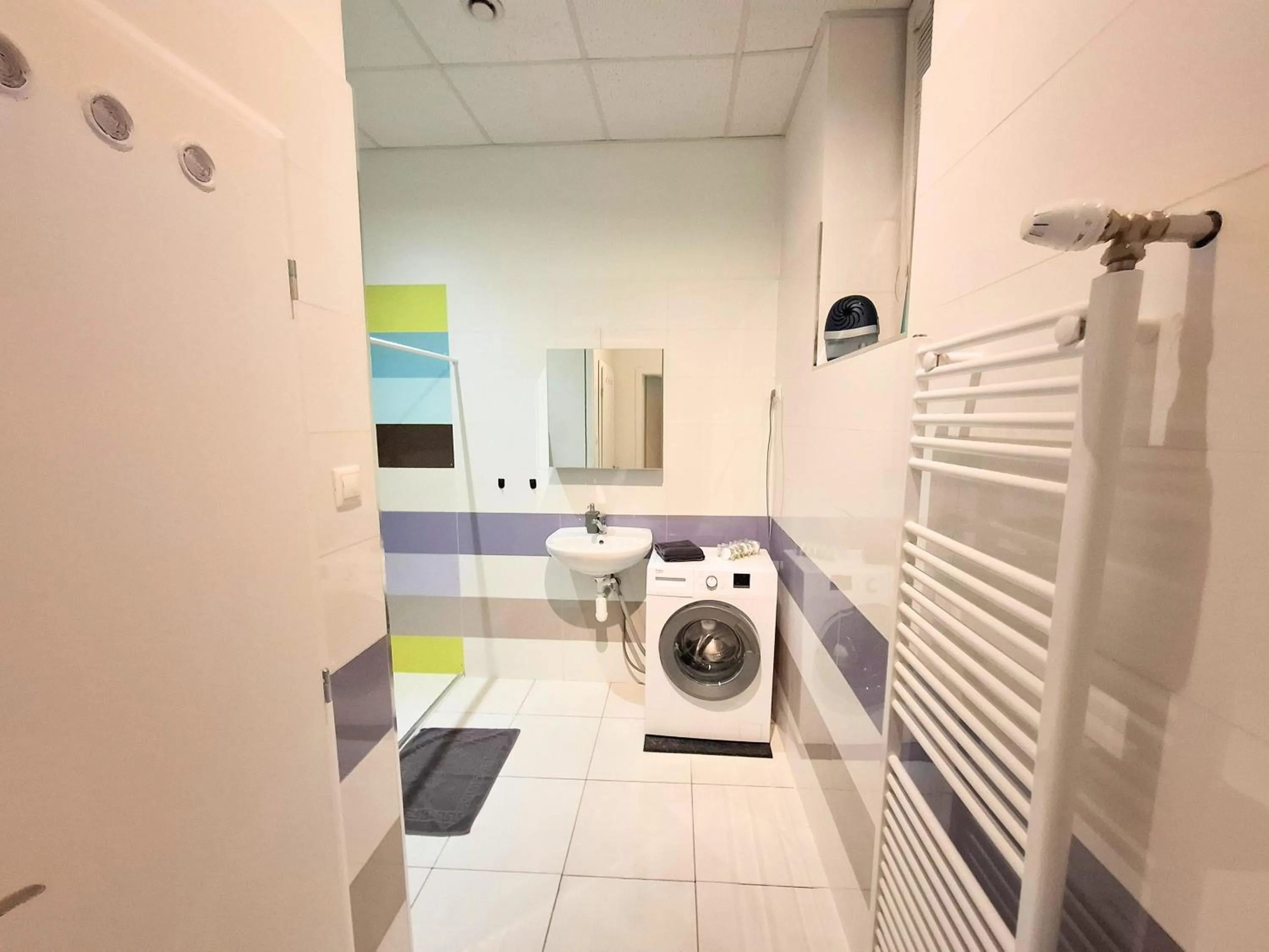 washing machine in Dimael Hostel & Apartments