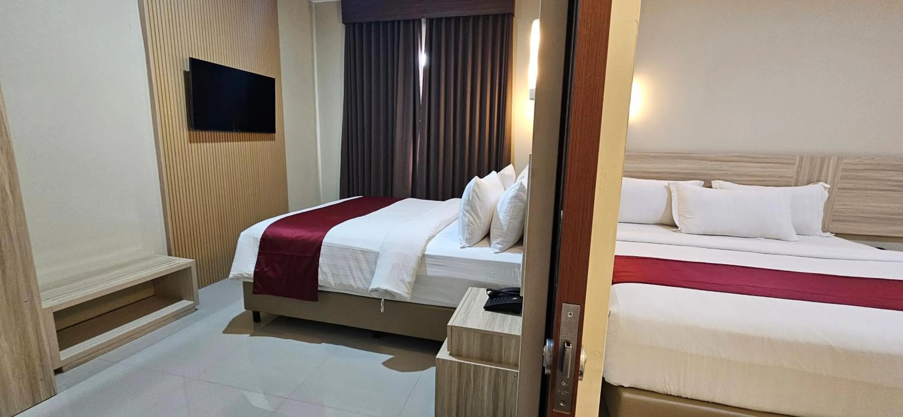 Photo of the whole room, Bed in Sunflower Hotel Syariah near Juanda Airport