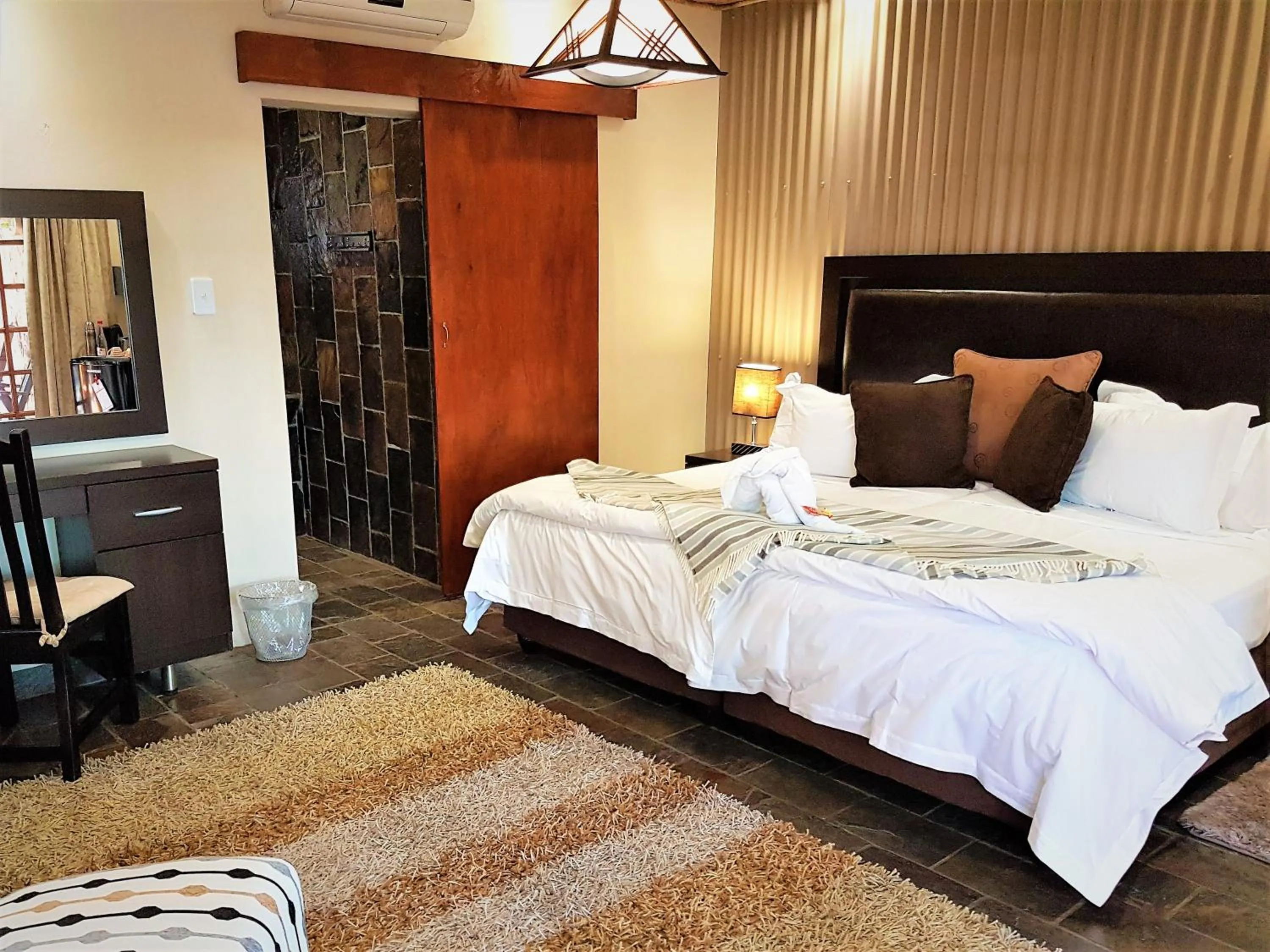 Bed in 61 On Ireland Guest House and Conferencing