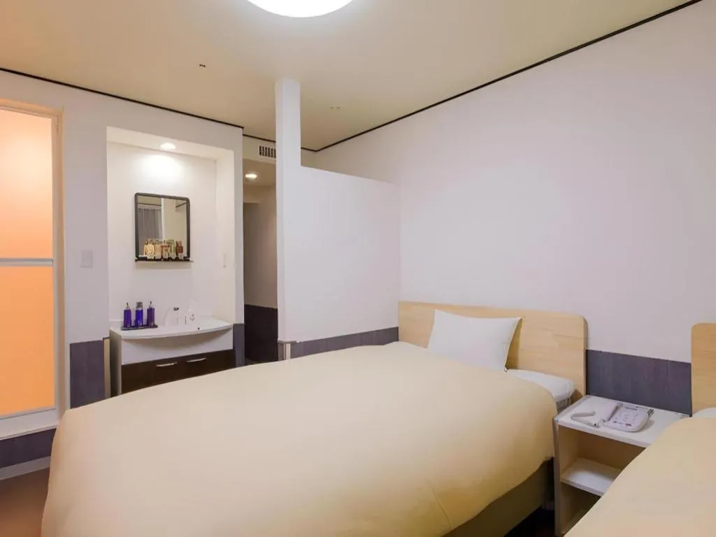 Bed in Ikebukuro Royal Hotel