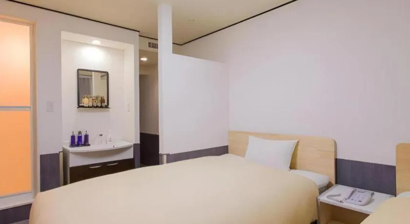 Bed in Ikebukuro Royal Hotel