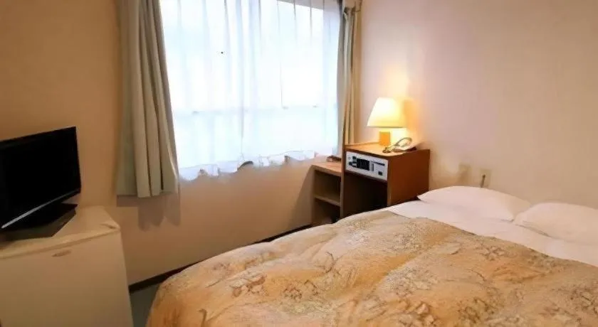 Bed in Ikebukuro Royal Hotel