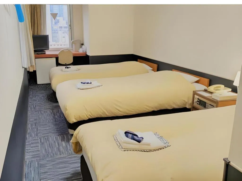 Bed in Ikebukuro Royal Hotel