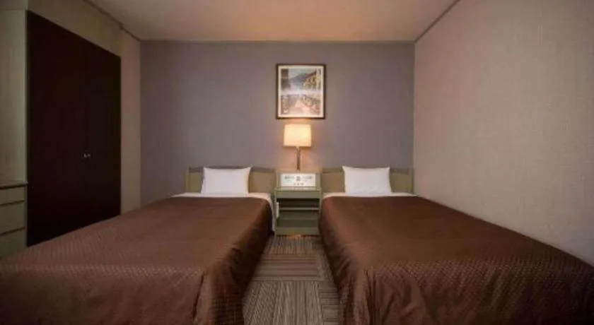 Bed in New Biwako Hotel