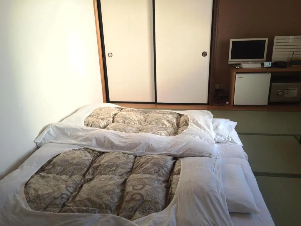 Bed in Hotel Kikuya