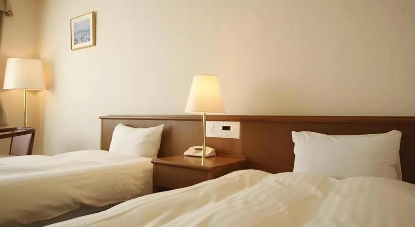 Bed in Kamisuwa Station Hotel