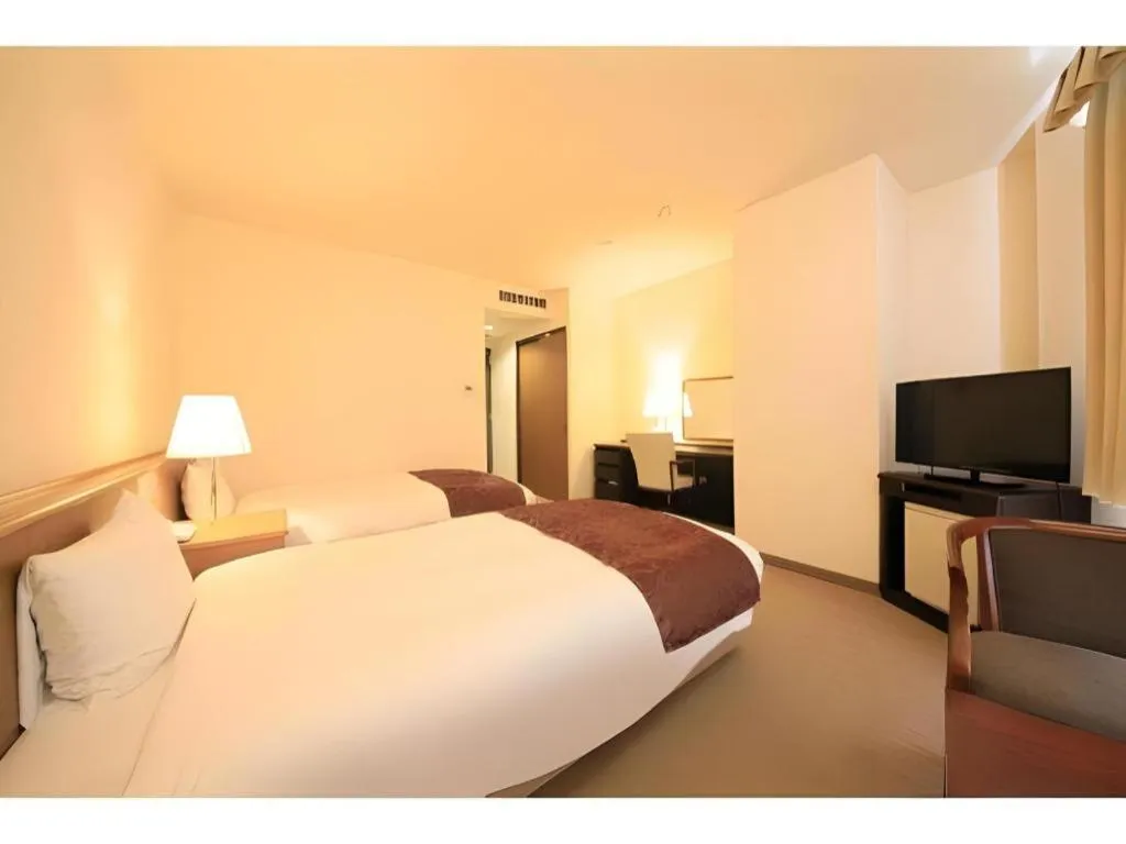 Bed in Kamisuwa Station Hotel