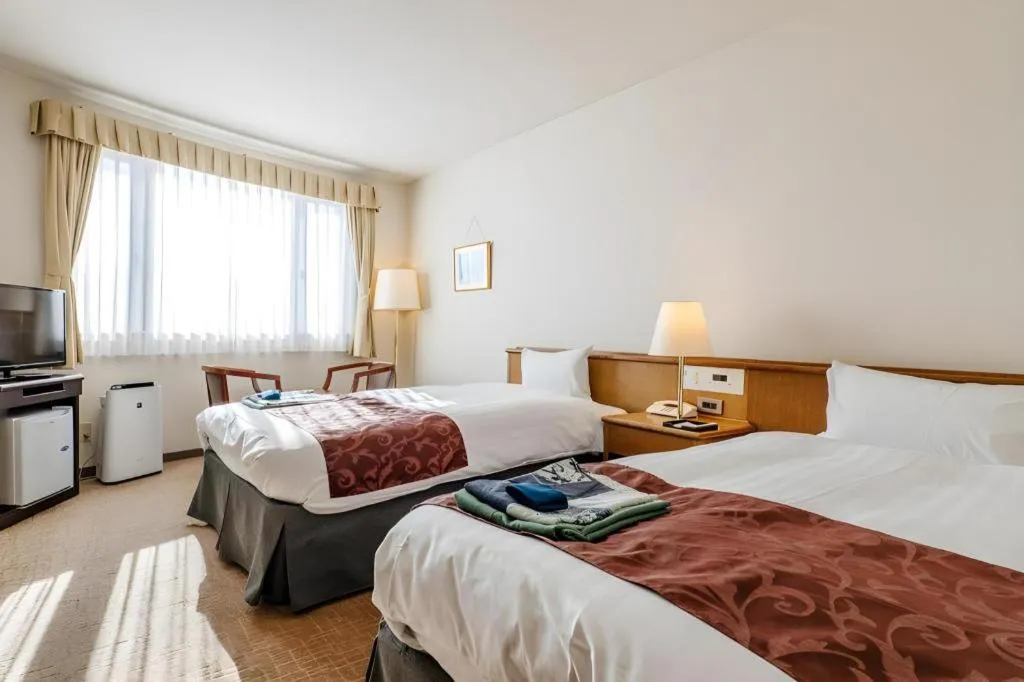 Bed in Kamisuwa Station Hotel