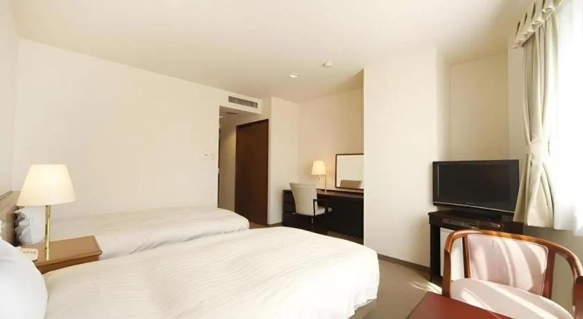 Bed in Kamisuwa Station Hotel