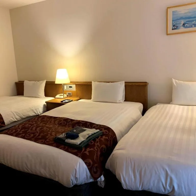 Bed in Kamisuwa Station Hotel