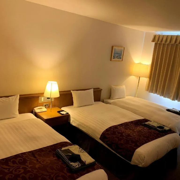 Bed in Kamisuwa Station Hotel