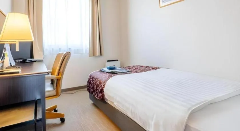 Bed in Kamisuwa Station Hotel