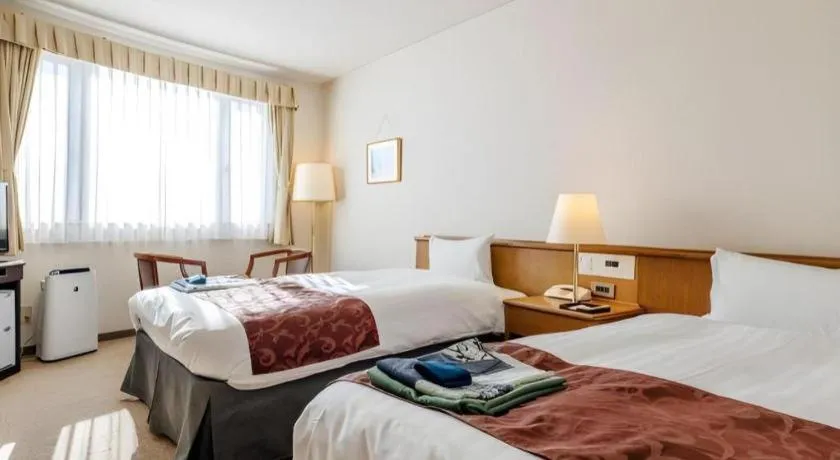 Bed in Kamisuwa Station Hotel