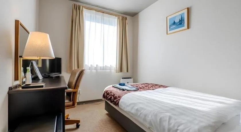 Bed in Kamisuwa Station Hotel