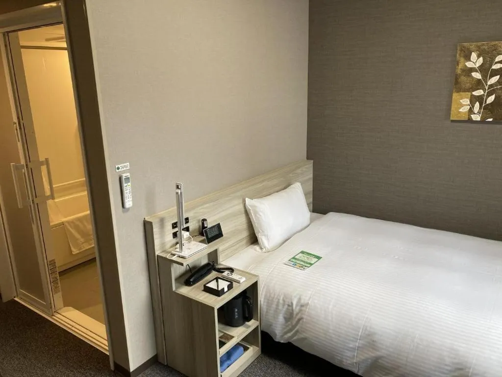 Bed in Hotel Route Inn Miyakonojo