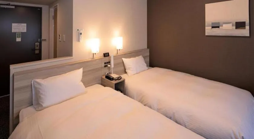 Bed in Hotel Route Inn Miyakonojo