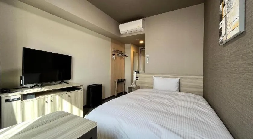 Bed in Hotel Route Inn Miyakonojo