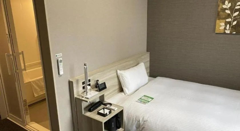 Bed in Hotel Route Inn Miyakonojo
