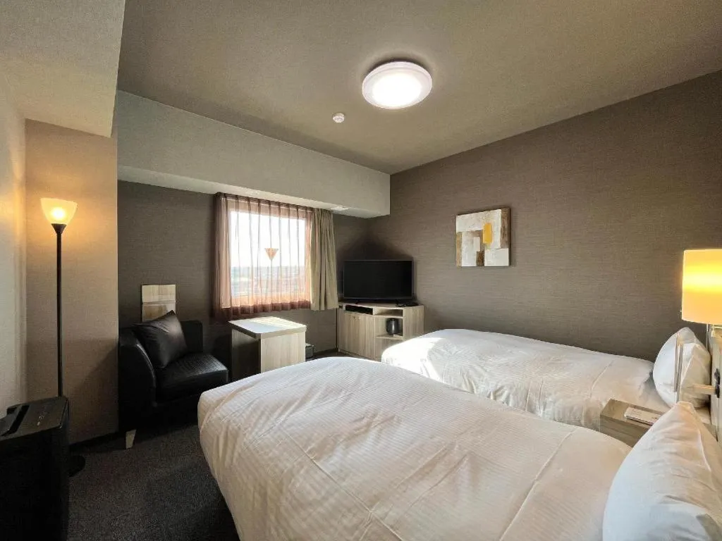 Bed in Hotel Route Inn Miyakonojo