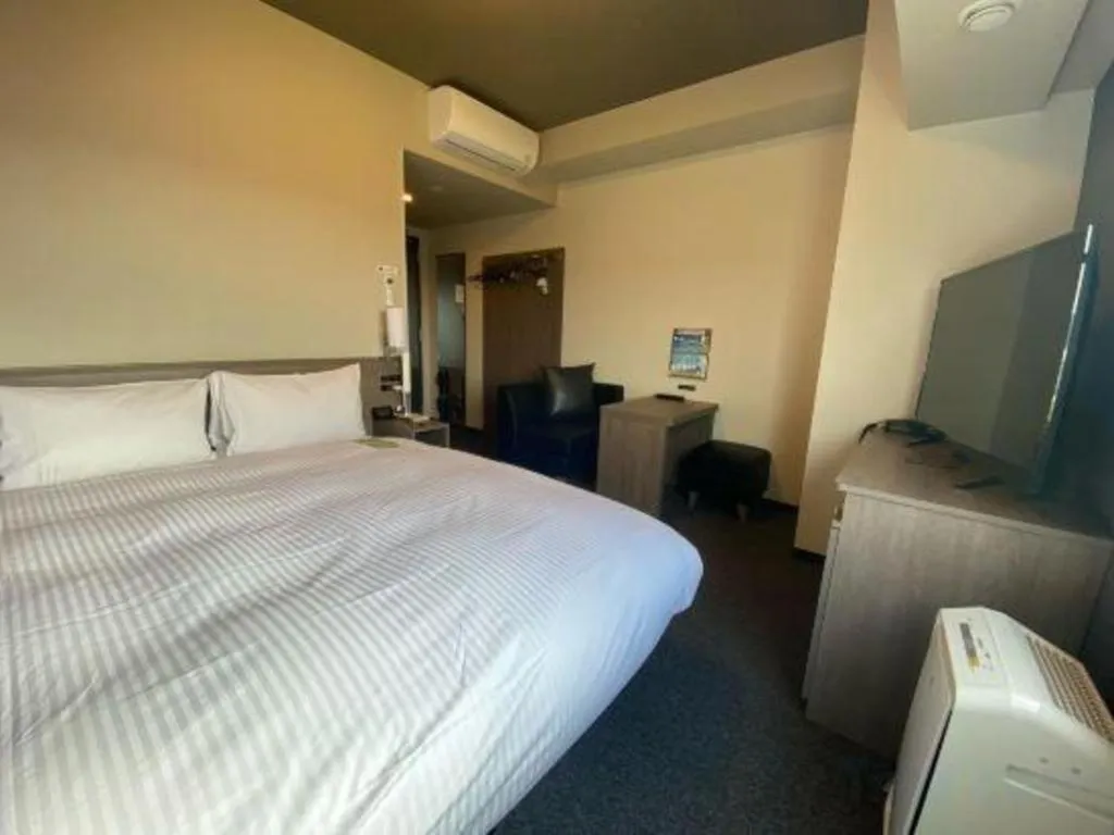 Bed in Hotel Route Inn Miyakonojo