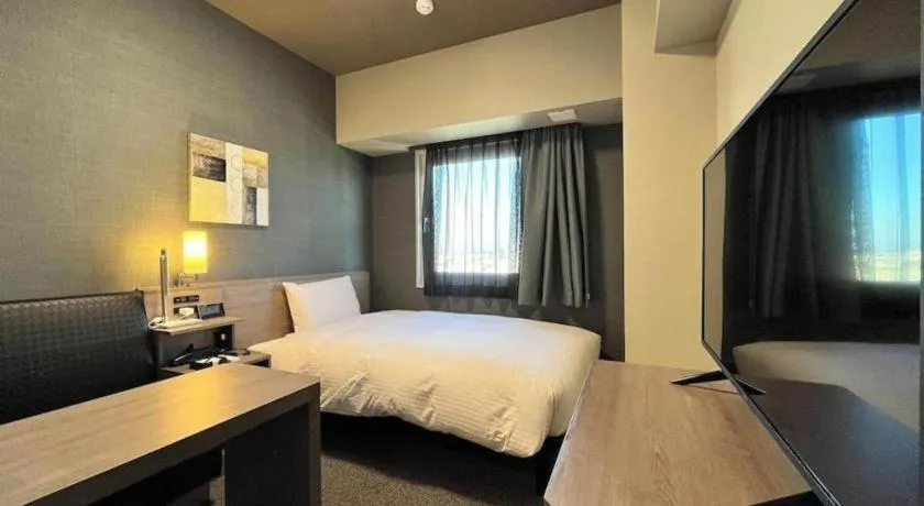 Bed in Hotel Route Inn Miyakonojo