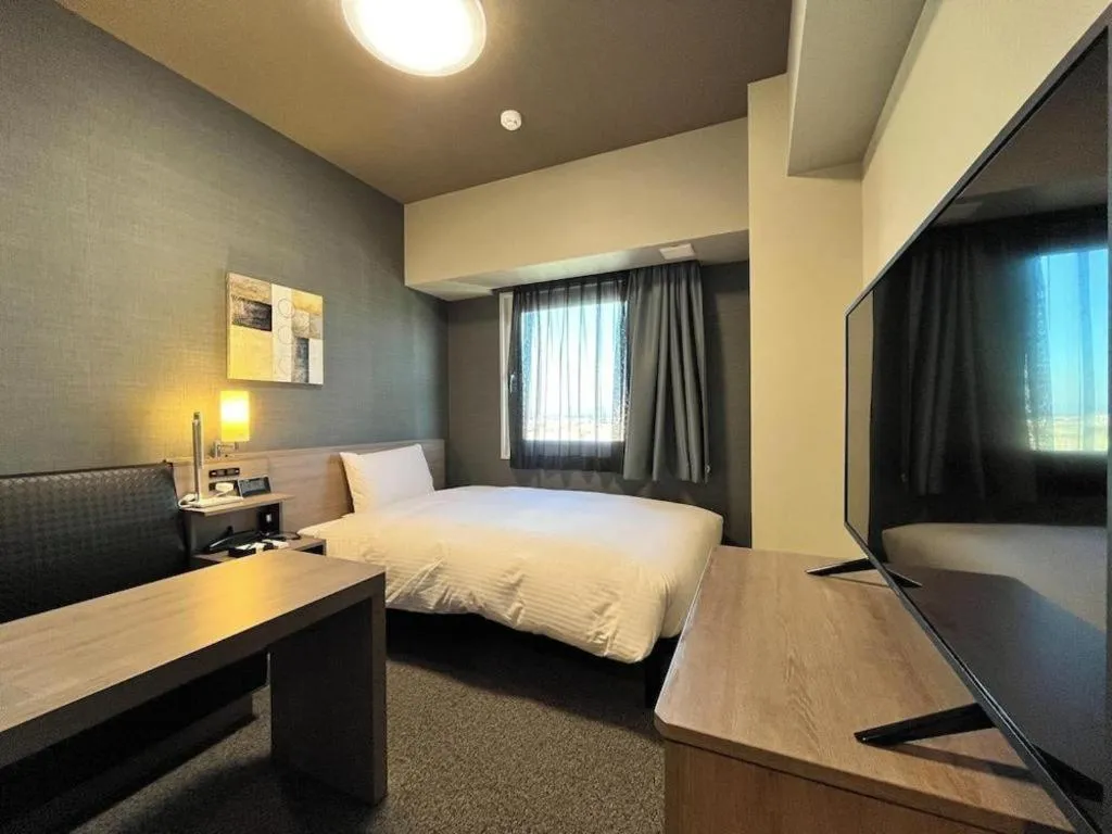 Bed in Hotel Route Inn Miyakonojo