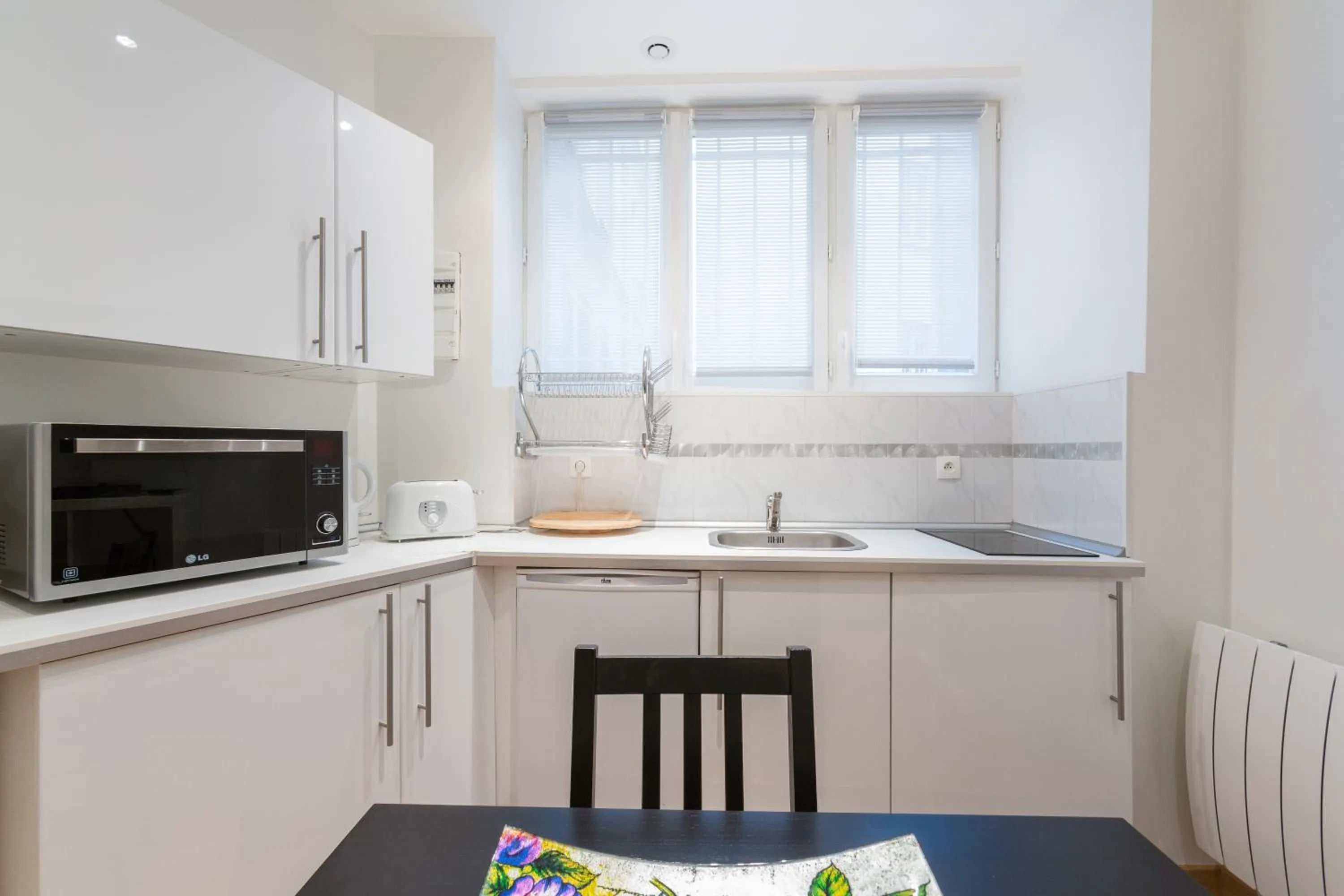 Kitchen or kitchenette in Appartement Petits Champs II