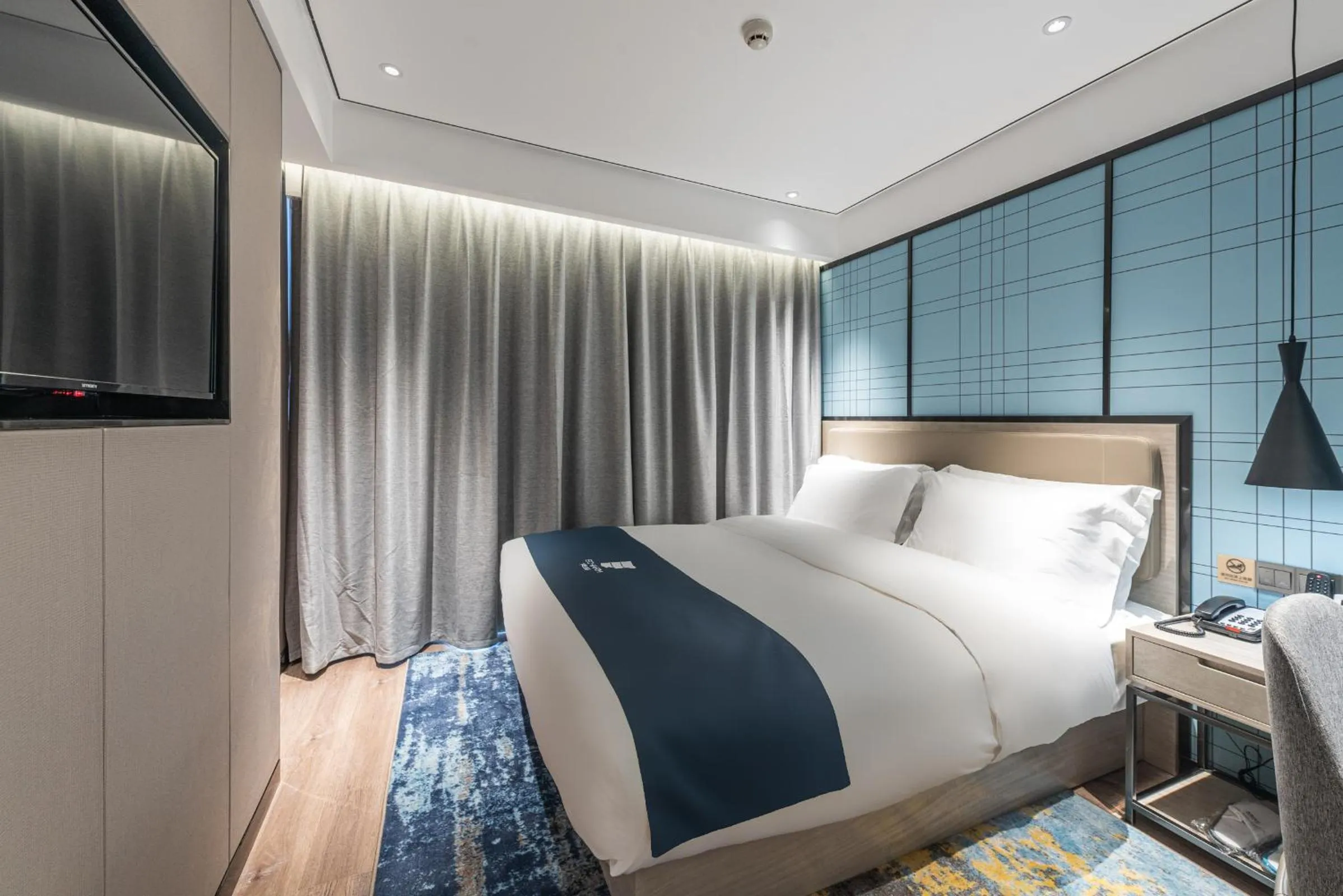 Bed in Echarm Hotel Yangshuo West Stree 宜尚酒店 阳朔西街店