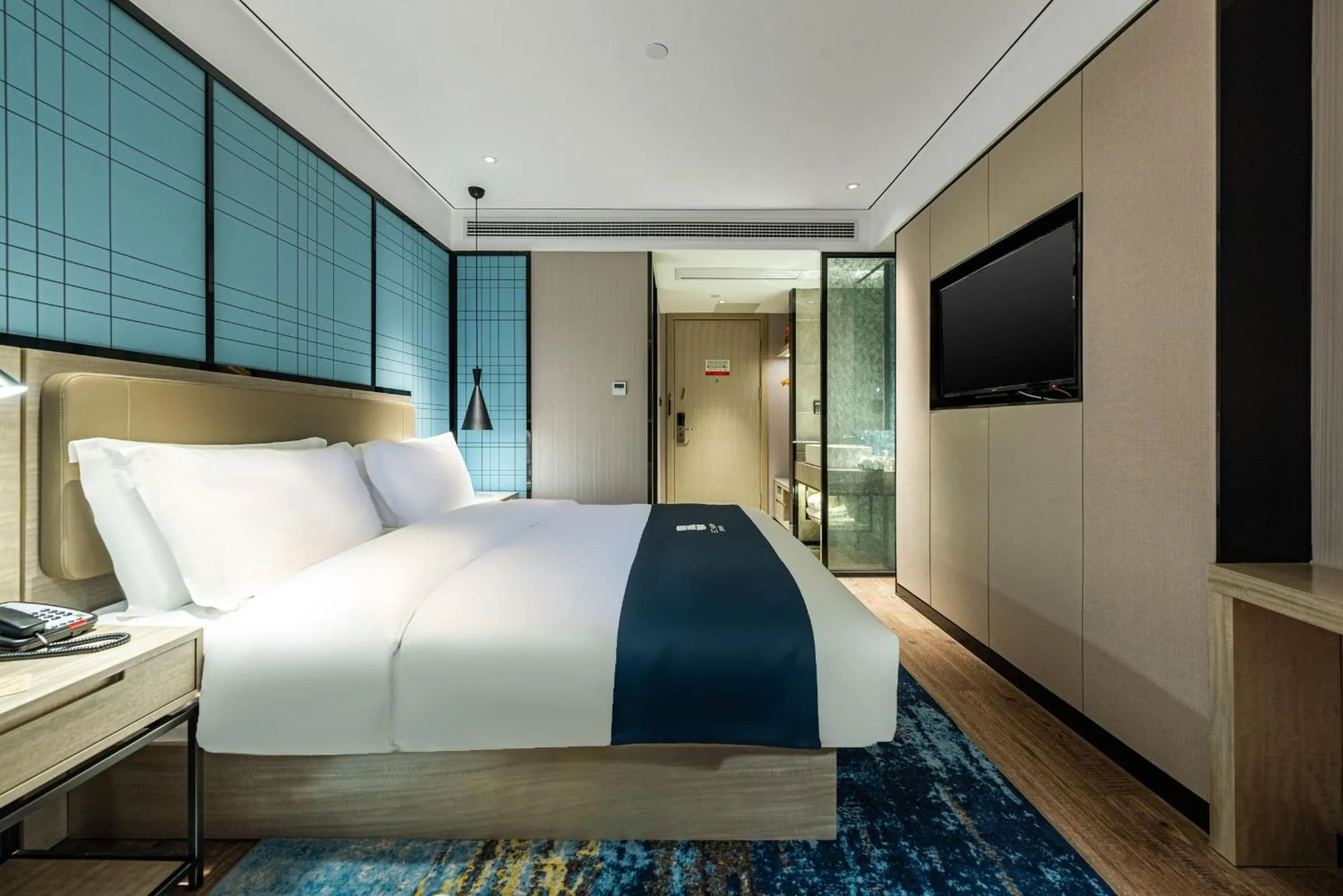 Bed in Echarm Hotel Yangshuo West Stree 宜尚酒店 阳朔西街店