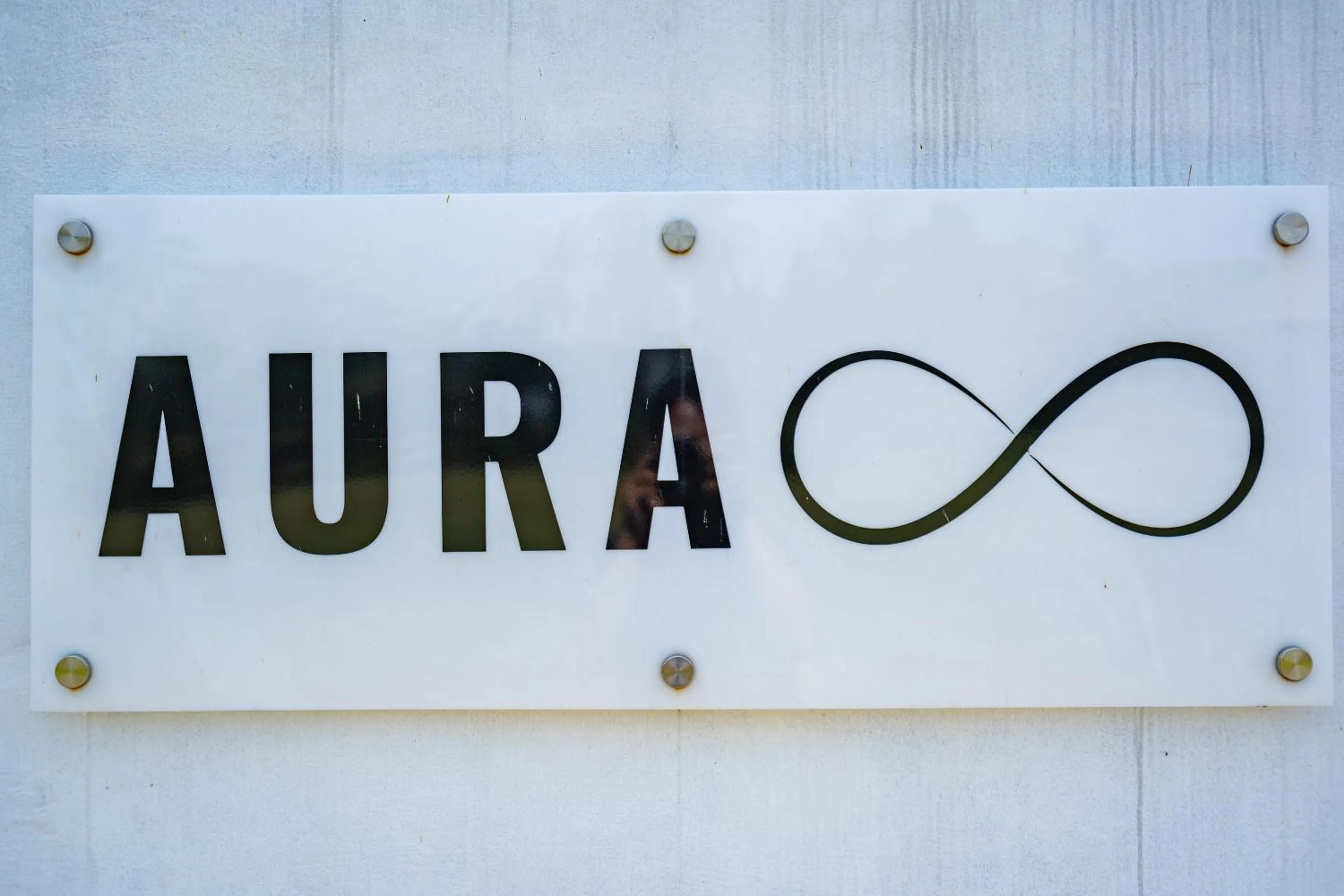 Property logo or sign in Aura Apartments Ubud