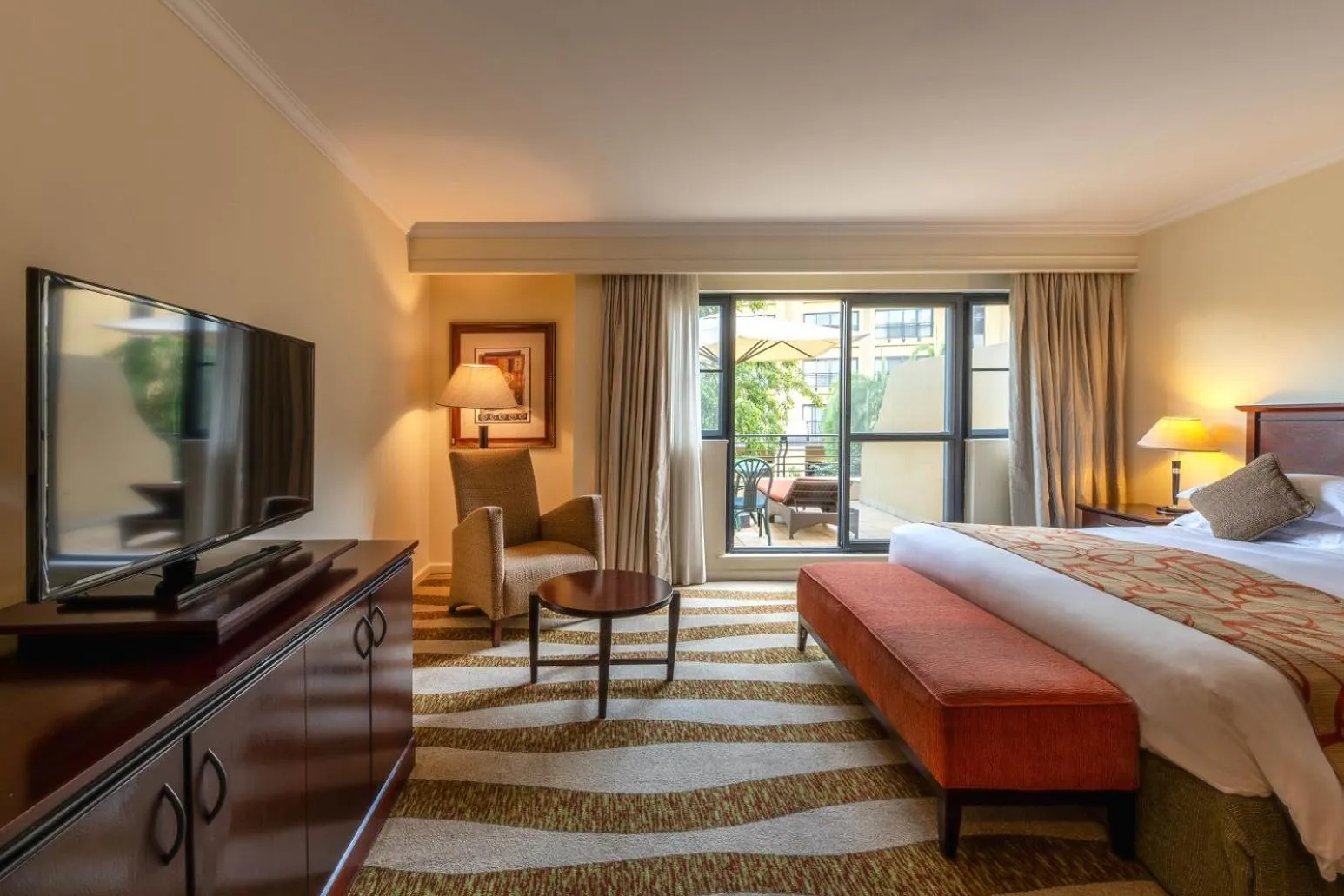 Seating area, Bed in Kigali Serena Hotel