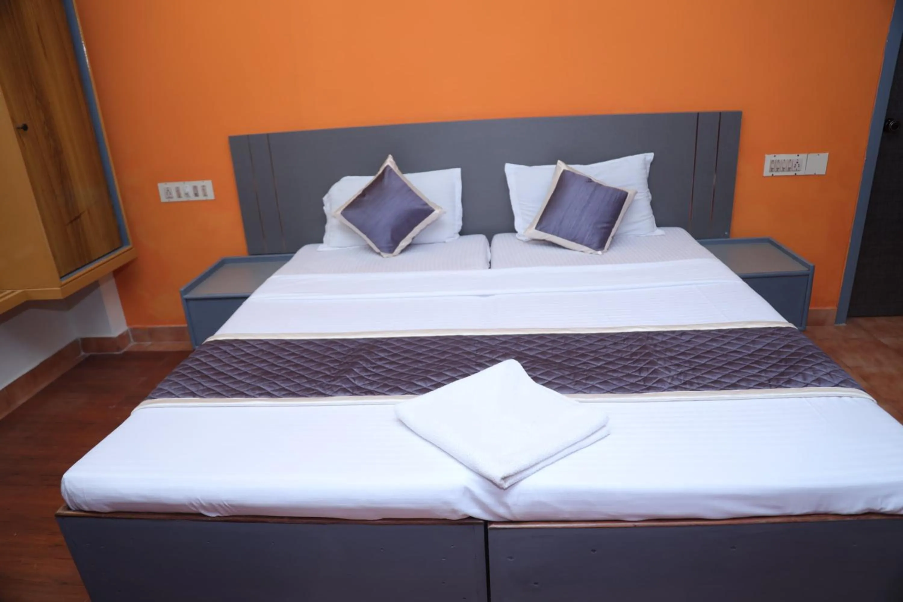 Bed in Grand Harmony Beach Resort