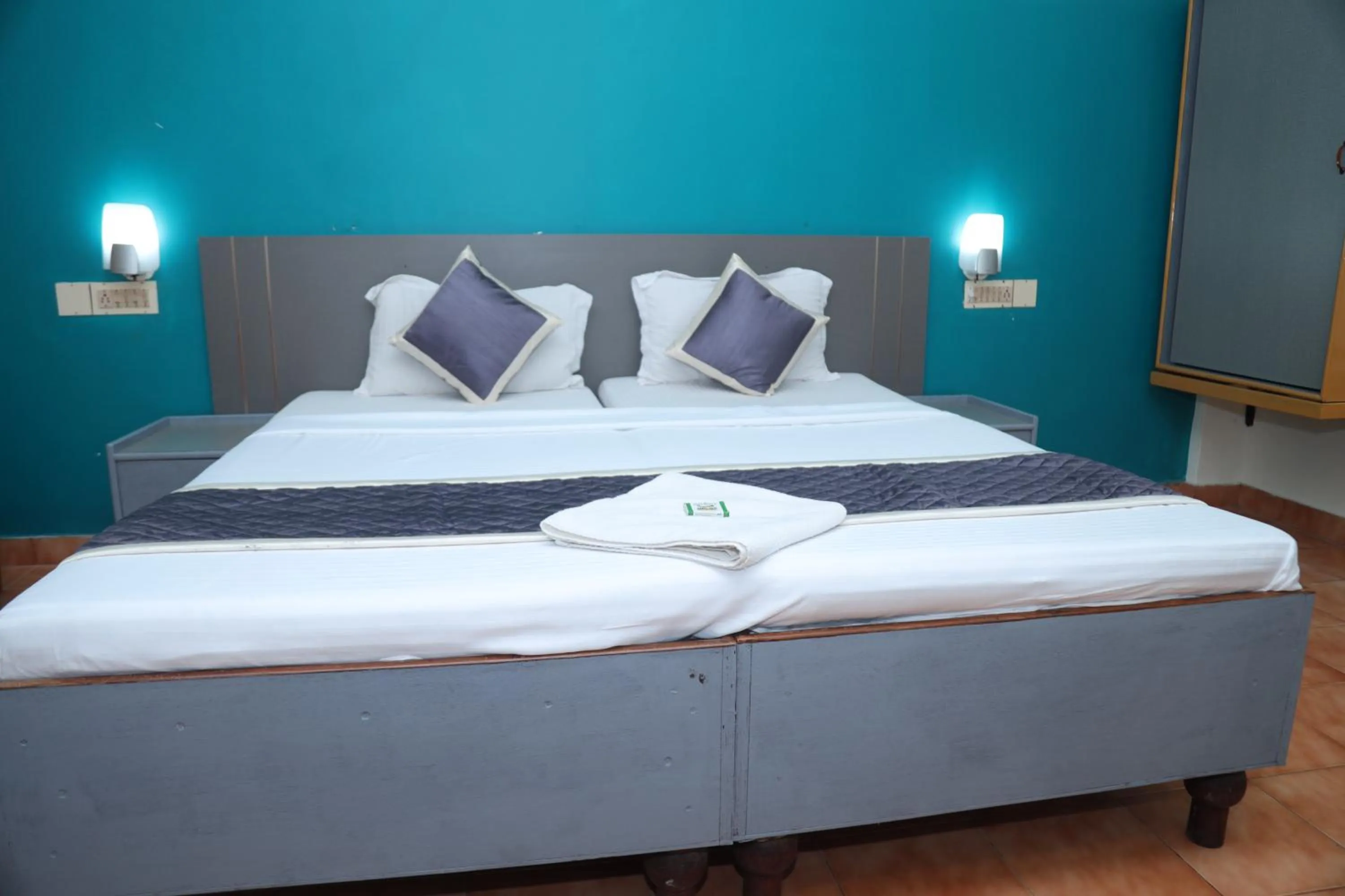 Bed in Grand Harmony Beach Resort