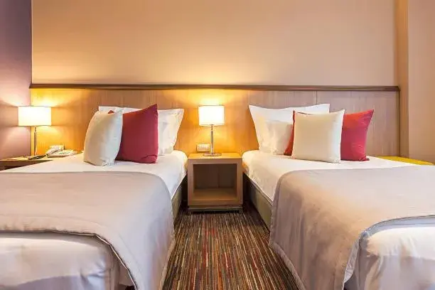 Bed in Grand Harmony Beach Resort Bed in Grand Harmony Beach Resort