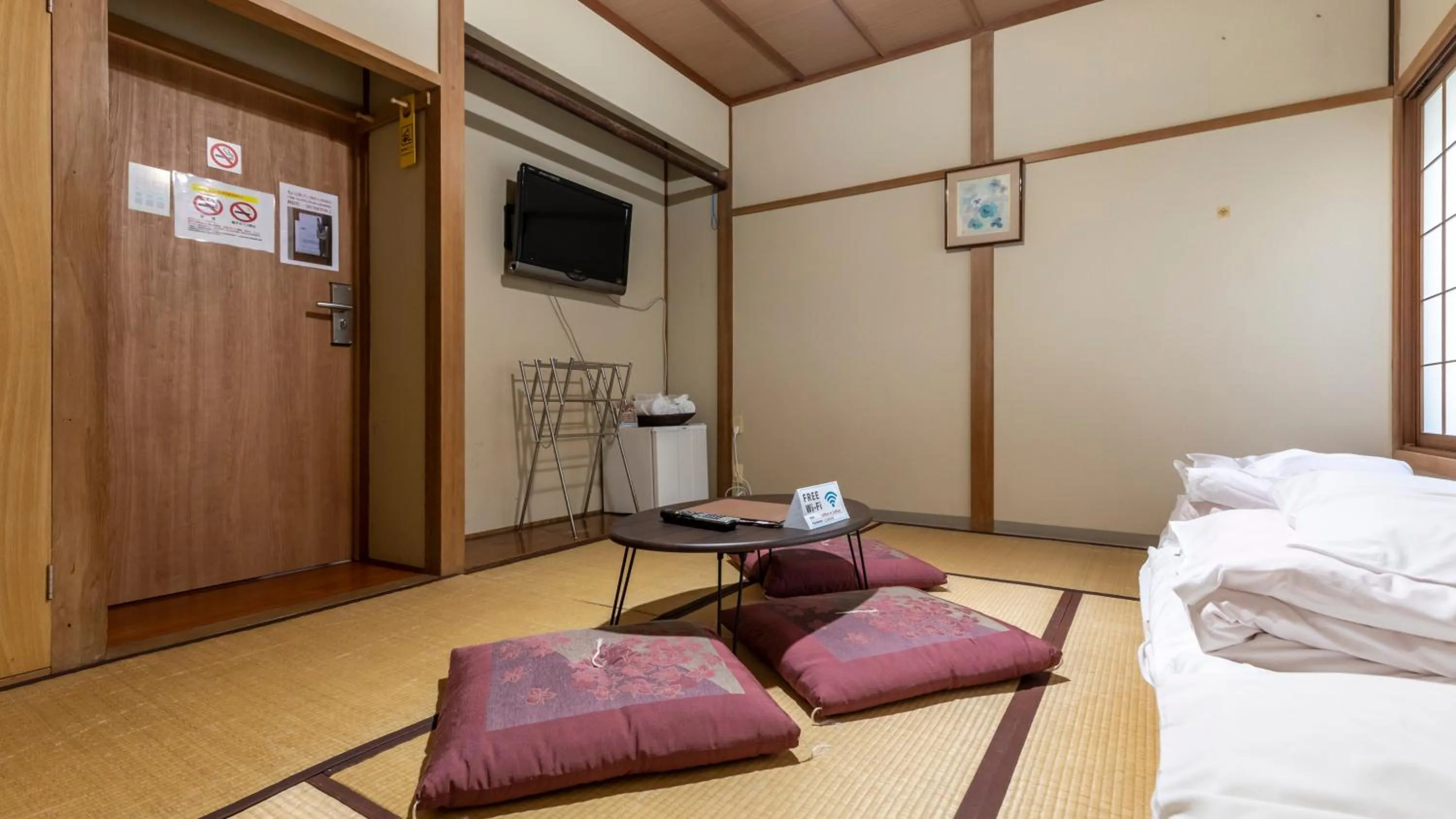 Bed in Tabist International Hotel Kaike