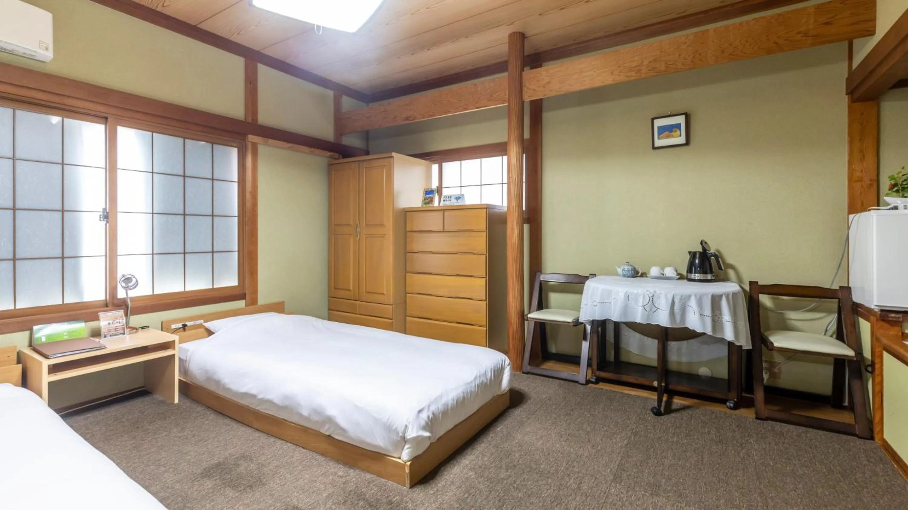 Bed in Tabist International Hotel Kaike