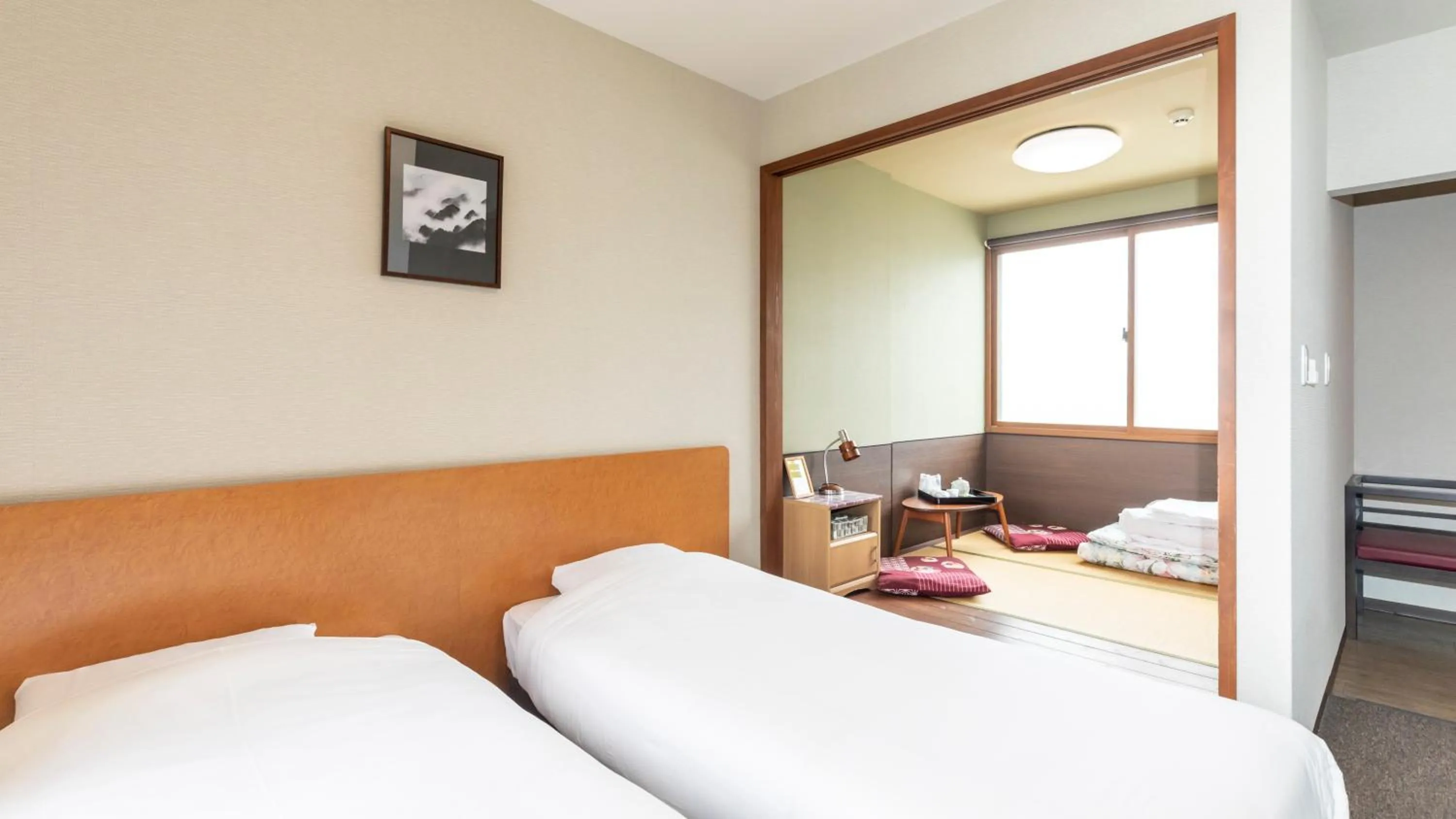 Bed in Tabist International Hotel Kaike