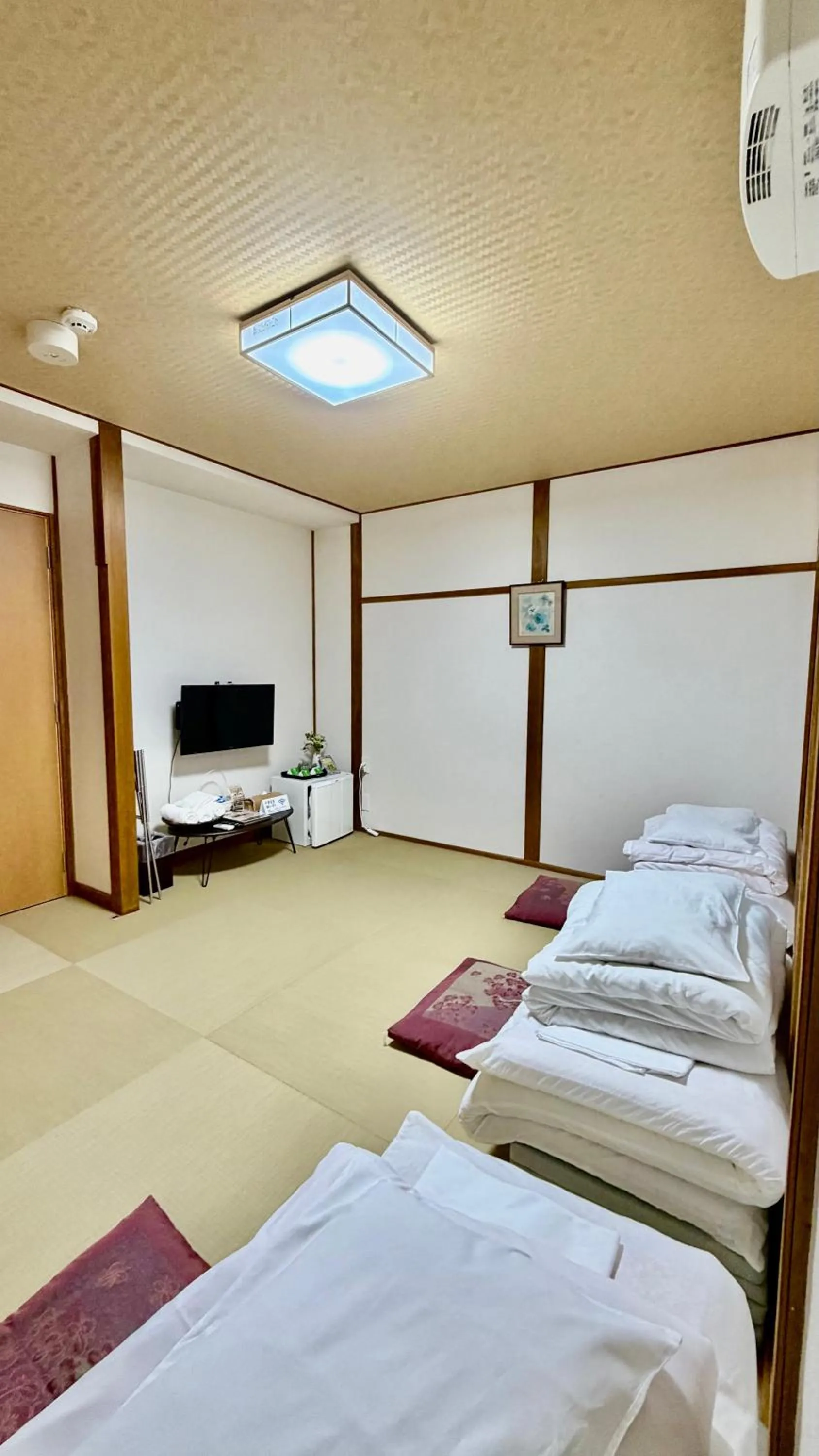 Bed in Tabist International Hotel Kaike