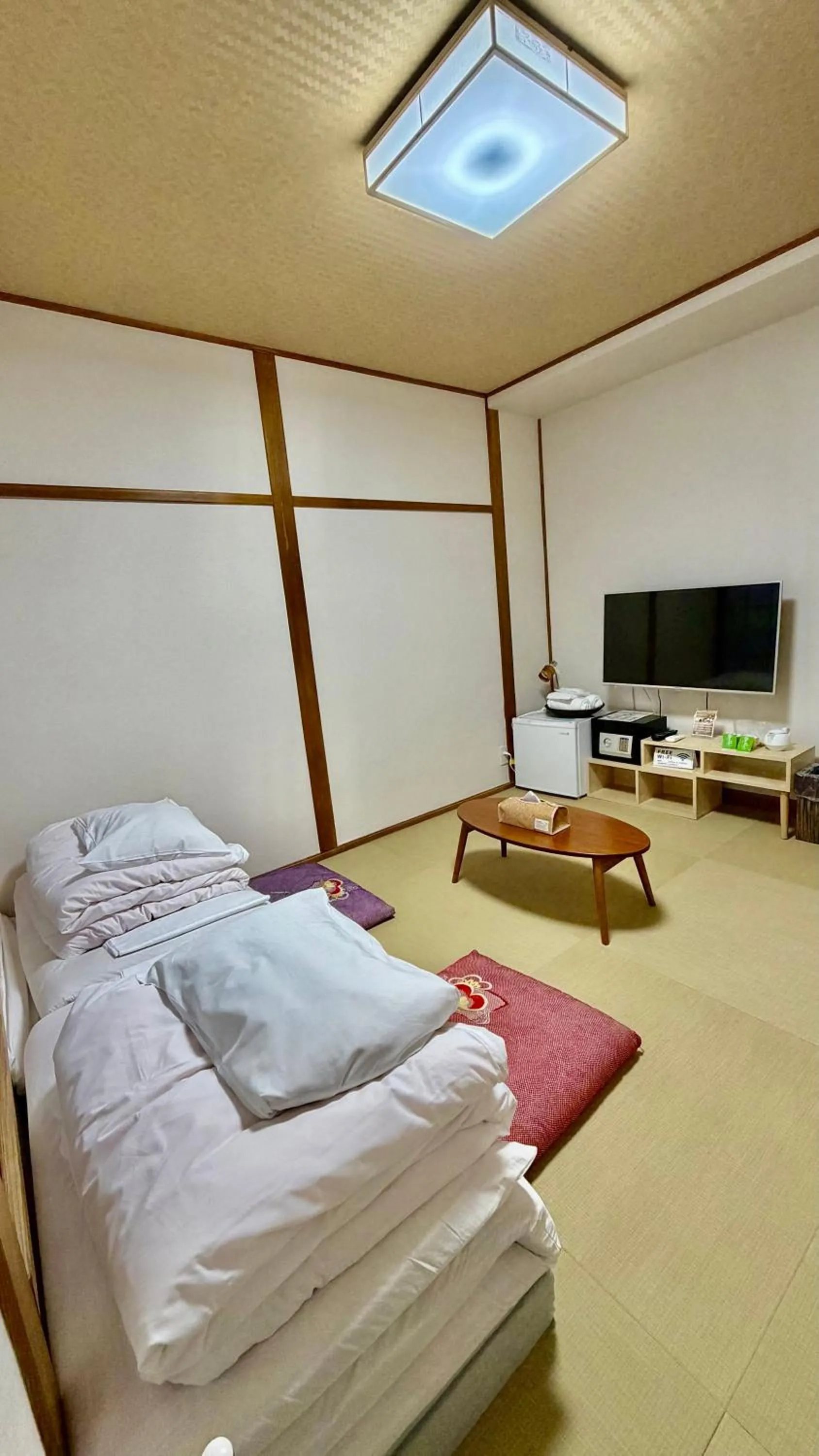 Bed in Tabist International Hotel Kaike