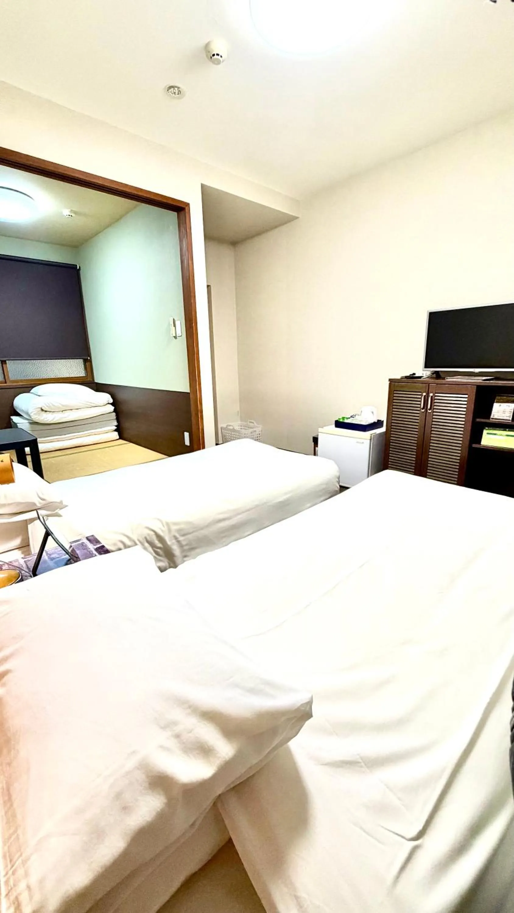 Bed in Tabist International Hotel Kaike