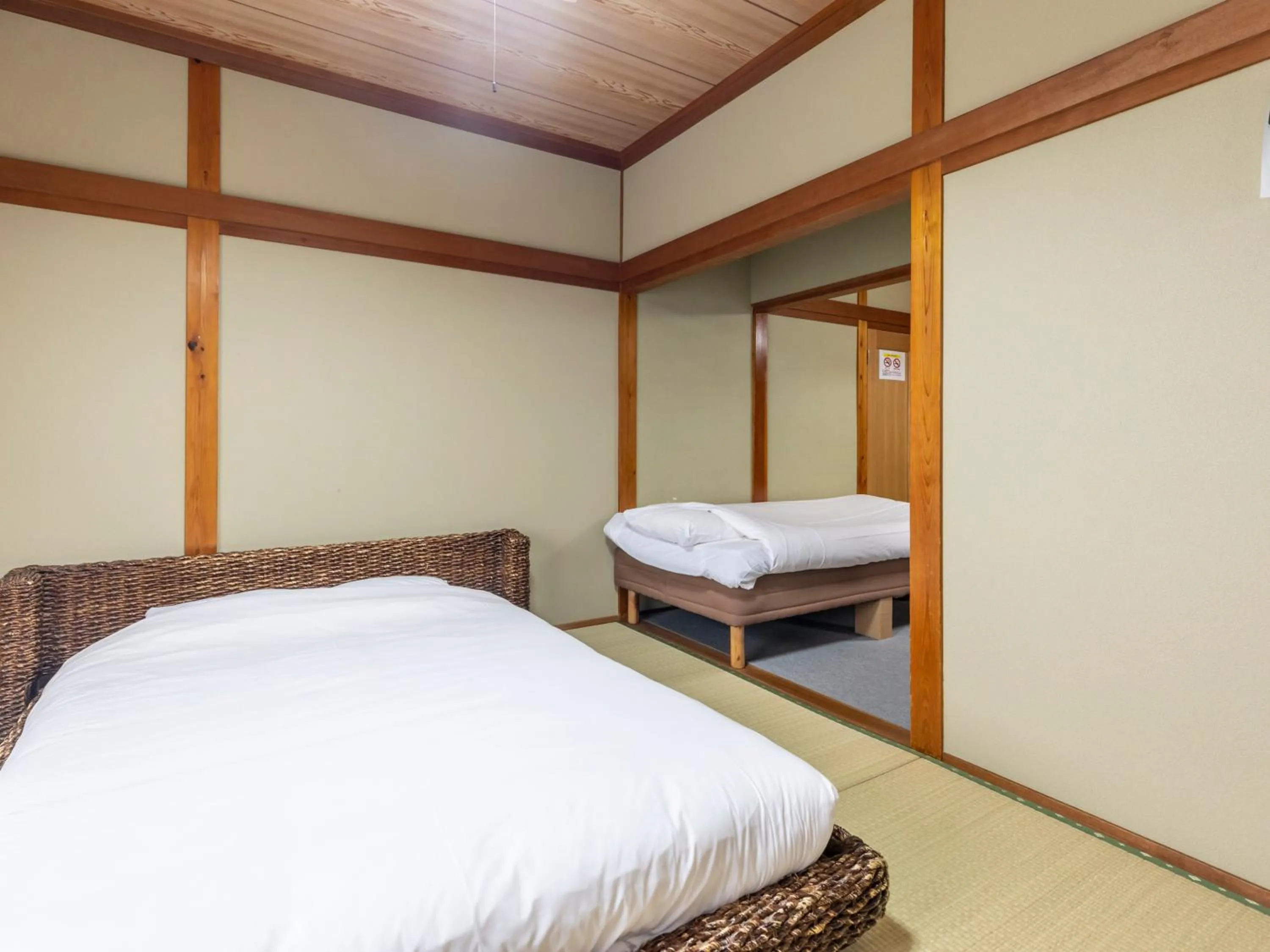 Bed in Tabist International Hotel Kaike