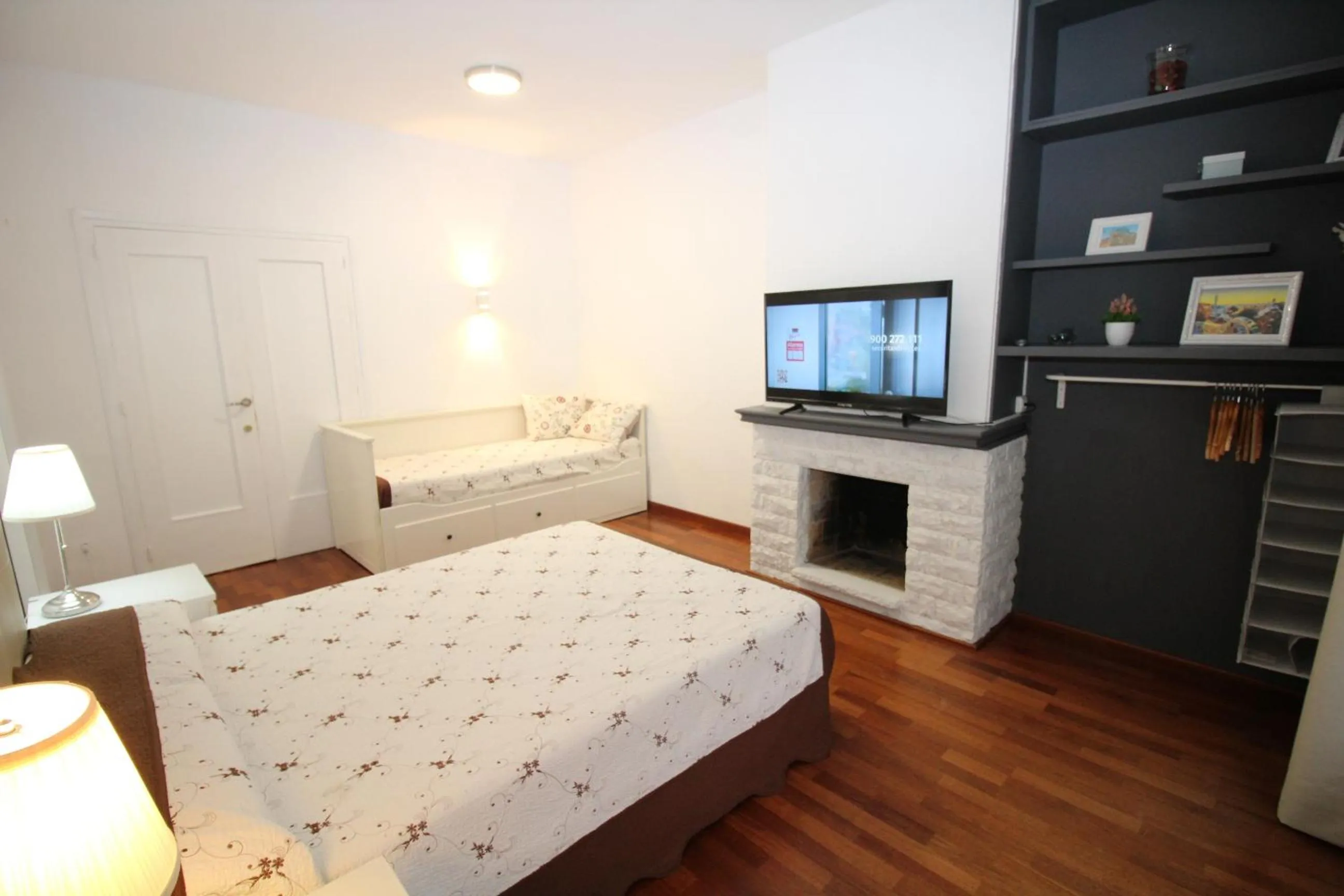 Bed in Viladomat Rooms